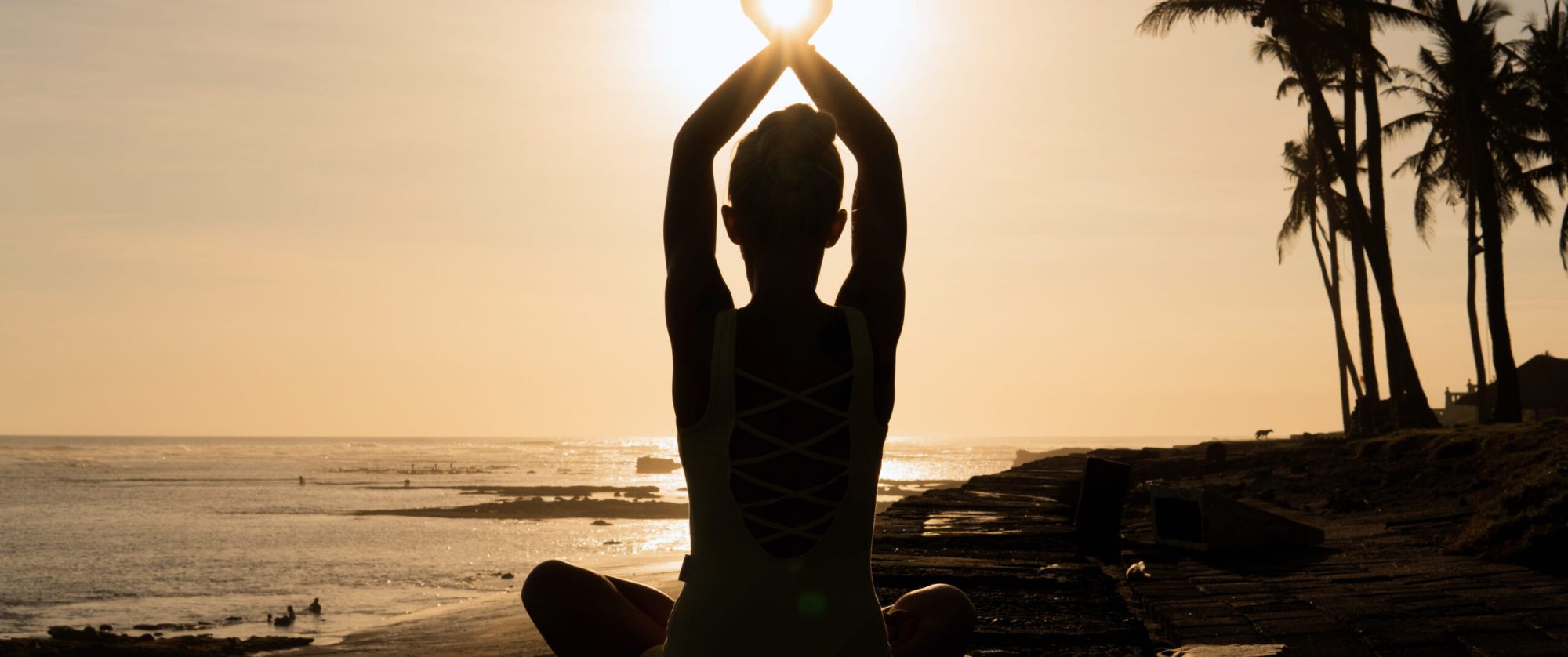 beautiful woman meditating outdoors. bali